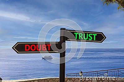 Trust or doubt symbol. Concept word Trust or Doubt on beautiful signpost with two arrows. Beautiful blue sea sky with clouds Stock Photo