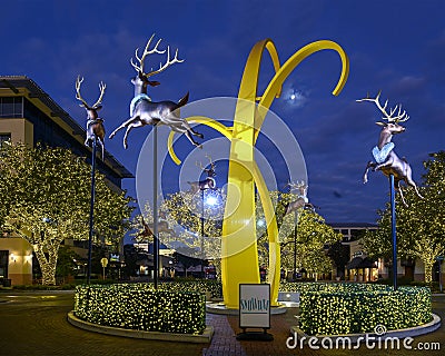 `Trust` by Michelle O`Michael surrounded by flying reindeer and trees adorned with Christmas Lights, Dallas, Texas Editorial Stock Photo