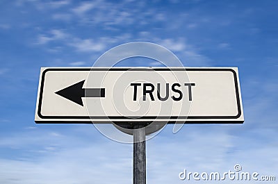 Trust road sign, arrow on blue sky background Stock Photo