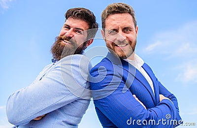 Trust us we are professionals. Men formal suits stand back to back blue sky background. Confident entrepreneurs bosses Stock Photo