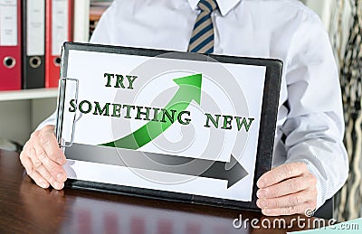 Try something new concept on a clipboard Stock Photo