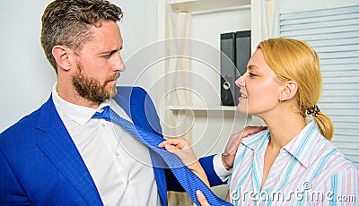 Try to seduce director. Female take sexual initiative. Office and sexual behavior. Woman hold mans necktie. Girl seduce Stock Photo