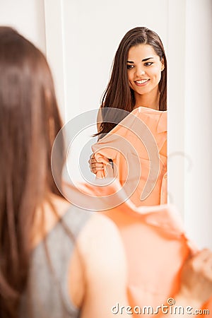 Trying clothes in front of a mirror Stock Photo