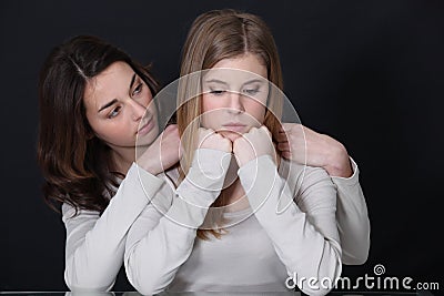 Trying to cheer up friend Stock Photo