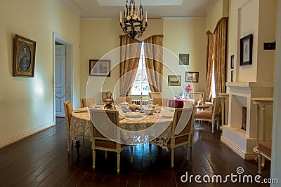 Tsinandali, Georgia - November 4, 2018: Vintage furniture. Round dining table with chairs around in the room Editorial Stock Photo