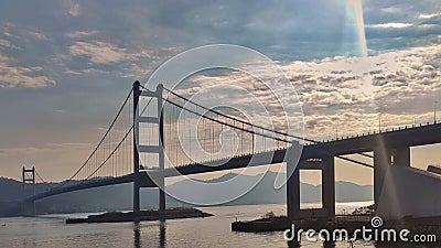 Tsing Ma Bridge from Ma Wan Tung Wan Beach with beautiful sky in Hong Kong Stock Photo