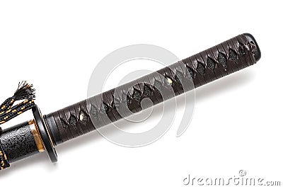 Tsuka: Handle of Japanese sword isolated in white background. Black rayskin and brown leather cord with steel fitting. Stock Photo