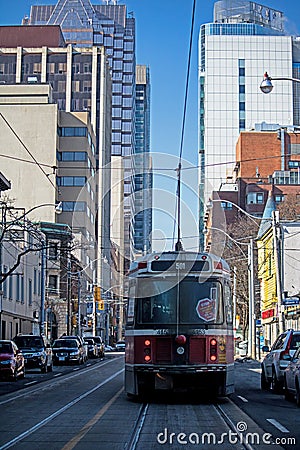 TTC Streetcar And Skyscrapers On Queen Street In Toronto Editorial Stock Photo