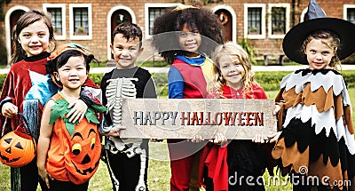 Little kids at a Halloween party Stock Photo