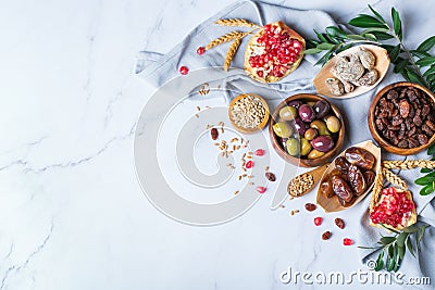 Tu Bishvat holiday symbols - dried fruits, pomegranate, barley, wheat Stock Photo