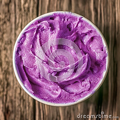 Tub of colorful purple berry ice cream Stock Photo