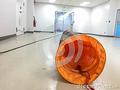 Tube Fan with confined space, Portable Ventilation Fans and Exhaust Fans from exit door at factory Stock Photo