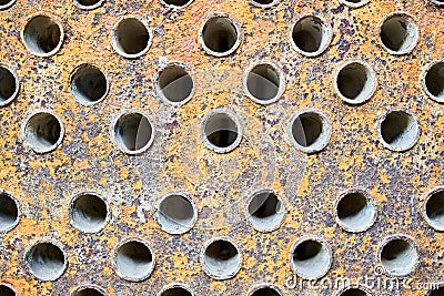 Tube sheet plate of industrial gas compressor heat exchanger or boiler closeup texture macro full of cracks insoluble Stock Photo