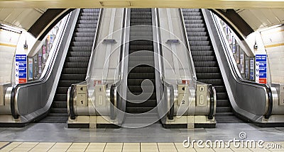 tube station exit, escalators, symetry Stock Photo