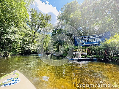 Tubers' exit sign on the Sante Fe River at Ginnie Springs Outdoors, Florida Editorial Stock Photo