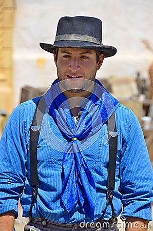 A young cowboy is a professional pastoralist or mounted livestock herder Editorial Stock Photo