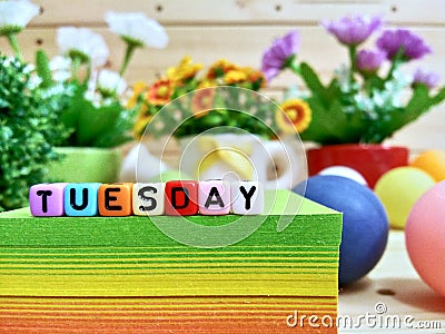 Tuesday. Colorful cube letters on sticky note block. Stock Photo