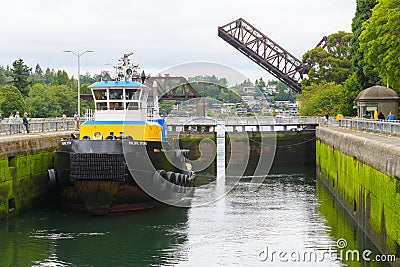 Tug boat Pacific Titan in the large Ballard Lock in Seattle Editorial Stock Photo