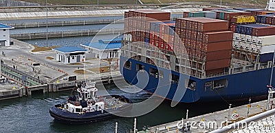 Container ship with tug boat Stock Photo