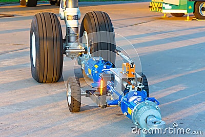 TUG carrier for an airplane, trailer front landing gear pushback aerodrome tractor, close up view Stock Photo