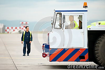 Tug pushback tractor in the airport. Editorial Stock Photo