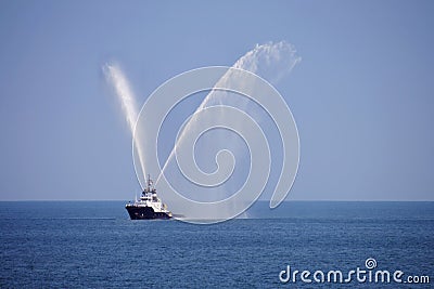 Tug showing fire fighting jets Stock Photo