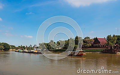 Tugboat and barge carry sand along the Chaophraya river Stock Photo