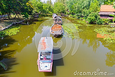 Tugboat on the canal in the Ancient Siam Stock Photo