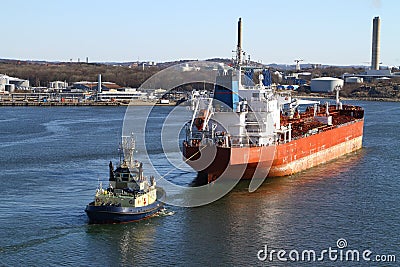 Tugboat with cargo ship Stock Photo