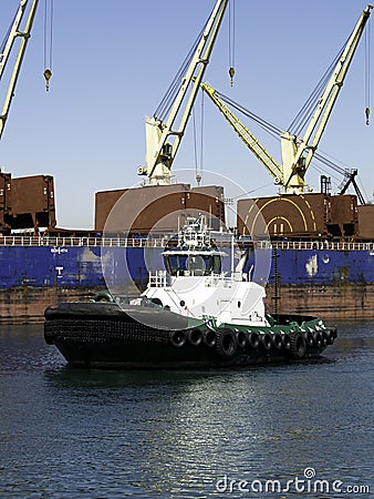 Tugboat and Cranes Stock Photo