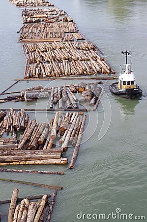 Tugboat and lumber Editorial Stock Photo