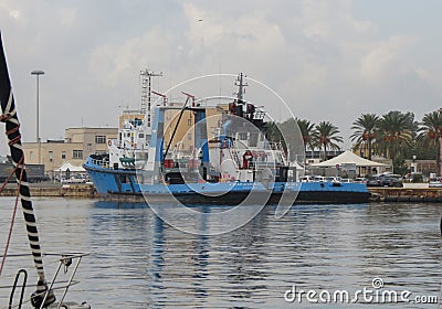 Tugboat moored at the harbour Editorial Stock Photo