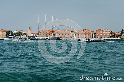 Tugboat sails off the coast of Venice Editorial Stock Photo