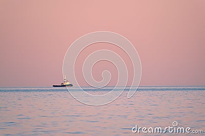 Tugboat on sunset Stock Photo
