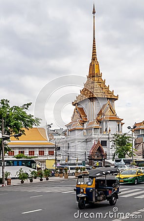 Tuk tuk and taxi traffic in the streets of central Bangkok, Thailand, with Wat Traimit, the Golden Buddha Editorial Stock Photo