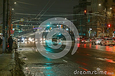 Tula, Russia - December 20, 2020: Night automobile traffic on wide city street - close-up telephoto shot Editorial Stock Photo
