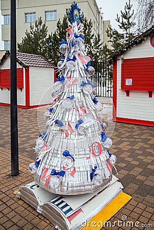 Christmas tree made of foil underfloor heating. Festival of creative Christmas trees on Metallist Editorial Stock Photo