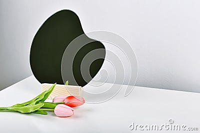 Tulip flowers bouquet for celebration with mirror. Artificial tulips on white table Stock Photo