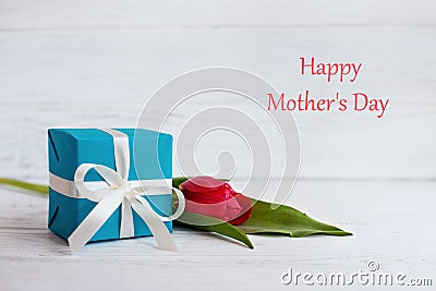 Tulip and gift for the mother. The concept of Happy Mother`s Day Stock Photo