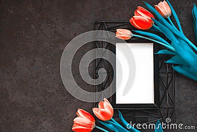 Tulips on a dark background, metal photo frame. Horizontal position with a copy of the space. Color of Aqua-Menta and Lush lava. Stock Photo