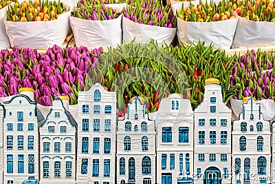 Tulips in a flower shop with souvenir Amsterdam canal houses in Stock Photo