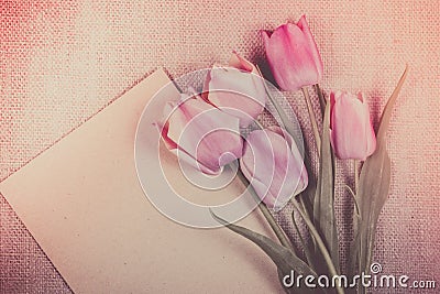 Tulips and sheet of paper. Mockup paper. Empty sheet of paper. Stock Photo