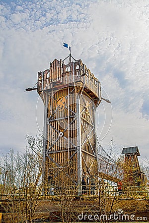2019_04_06_Tulsa OK USA - Wooden castle climbing playhouse with metal bridge to another building at The Gathering Place - public Editorial Stock Photo