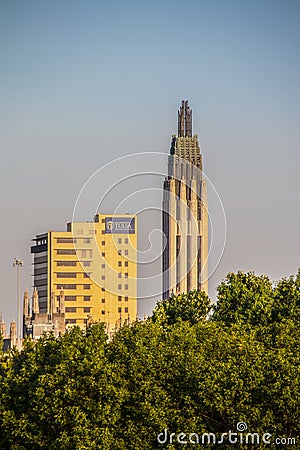 Tulsa USA - Oklahoma State University Medical Center and Boston Avenue Methodist Church tower over the trees in city Editorial Stock Photo