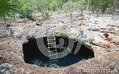 TULUM, MEXICO - Oct 11, 2019: Cenote Calavera jump Editorial Stock Photo