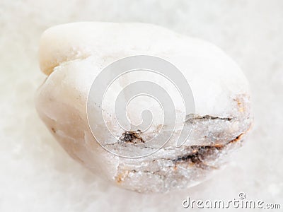tumbled piece of white marble stone on white Stock Photo