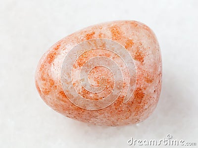 tumbled sunstone (heliolite) gem stone on white Stock Photo