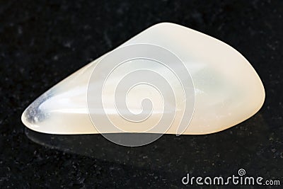 tumbled yellow moonstone (adularia) gem on dark Stock Photo