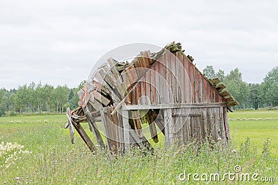 Tumbledown barn on a field Stock Photo