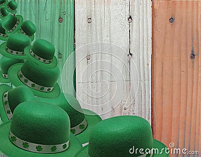 Tumbling Green Leprechaun Hats Over Irish Flag Colored Boards Stock Photo